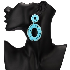 Winding hand-woven raffia geometric stud earrings Blue